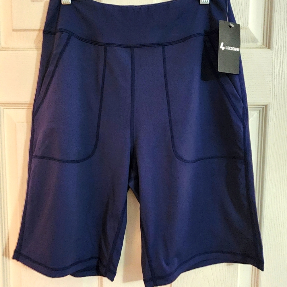 Blue Bike Shorts with Wide Waistband and Structured Fabric. 80% POLY - 20% SPAND